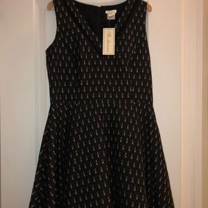 Sleeveless dress, mini length. Just above knee.